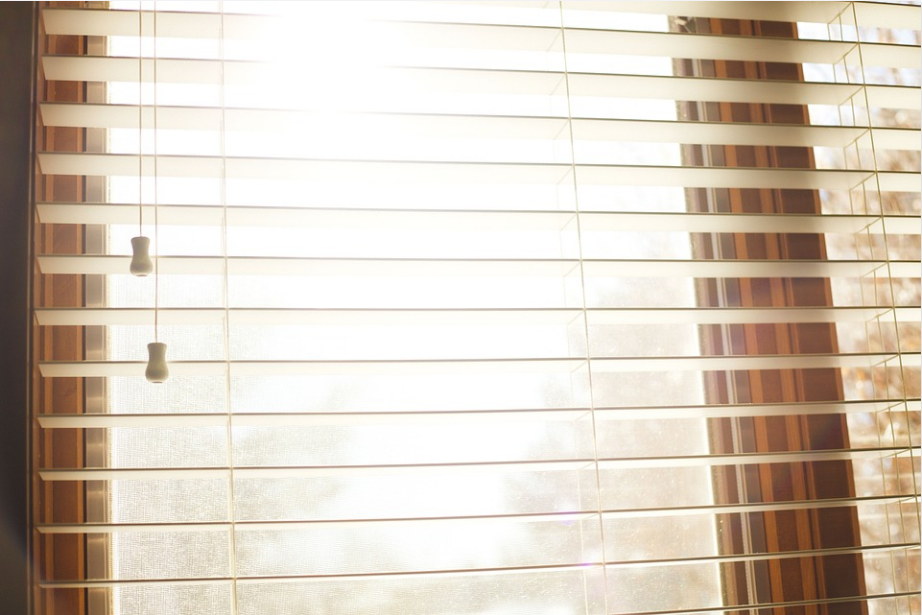 a closeup shot of a window with blinds